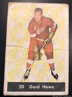 Front of the vintage 1961-62 Parkhurst Gord Howe hockey card, worn with creases and some discoloration.