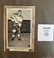 Front view of the framed 5x7 black and white Don Marshall hockey photo, showing the player in full uniform with stick, name plate visible below the photo.