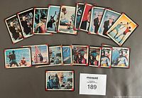Top side view showing 20 Batman trading cards laid out in various arrangements, showcasing front card images from the 1966 Batman TV series.