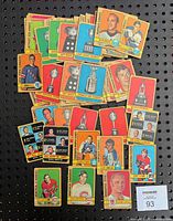 Front view of vintage hockey cards showing player images and trophy illustrations from 1972-73 O.P.C. set.
