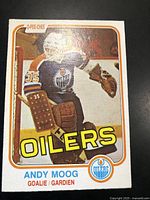 Front image of the 1981-82 O-Pee-Chee Andy Moog rookie card, showing clear photo of goalie in Oilers uniform with crease-free surface and minor corner wear.