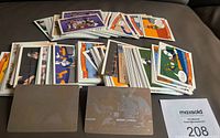 Lot of 210 Upper Deck Looney Tunes trading cards, front side showing colorful cartoon images and characters, also included two metallic foil insert cards