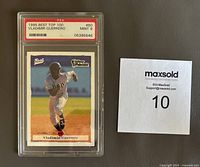 Front view of the 1995 Best Top 100 Vladimir Guerrero Expos baseball card number 80 in PSA graded protective case, showing player running and card details.