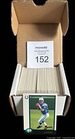 Box filled with neatly organized 1998 Bowman Chrome Football card set #1-220, front shows a Peyton Manning rookie card placed upright in front of the box.