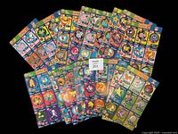 Full view of 20 uncut sheets fanned out showing colorful Pokemon cards from 'The First Movie' collection.