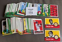 Overview photo showing the large stack of 2001 Upper Deck Vintage baseball cards, including various player cards and two visible "Timeless Teams" Game Used Bat insert cards.