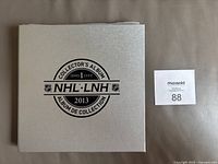 Silver-finished hardcover album cover showing NHL 2013 Collector's Album Series 1 branding.