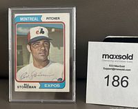 Front view of the Bill Stoneman Montreal Expos 1974 Topps baseball card showing the player's image and autograph, encased in plastic.