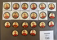 Row of 21 Chicago Black Hawks hockey coins showing player portraits with red jerseys, arranged on surface with protective holders for some.