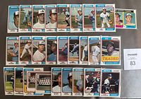 Photo showing front sides of 28 Montreal Expos 1974 Topps baseball cards including players and team cards. Cards arranged in rows showing player portraits/action shots with team name at top.