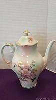 Full view of Schumann porcelain coffee pot with Wild Rose floral decoration and gold trim.