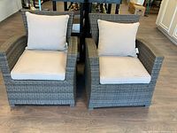 Both patio chairs arranged side by side showing front view