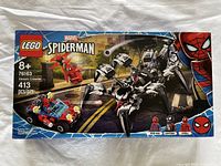 Front of the unopened LEGO box featuring Venom Crawler set with Spider-Man and Venom minifigures, 413 pieces, recommended age 8+