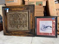 Both framed artworks side by side showing full fronts