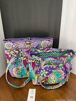 Large tote, medium satchel with attached pouch – front view displays print and size comparison