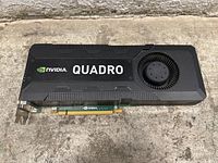 Top view of Nvidia Quadro graphics card showing cooling fan, Nvidia Quadro branding, and PCIe connector.