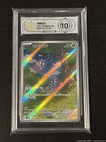 Front side of graded Tangela Pokémon card in plastic case showing card artwork and grade label.