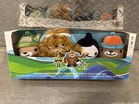 Front view of official Vancouver 2010 Winter Olympics mascot plush collector's set with four characters in original packaging.