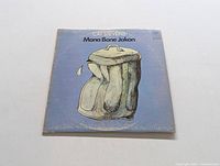 Front album cover of Cat Stevens Mona Bone Jakon LP showing crumpled brown paper bag illustration on blue background.