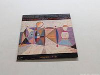 Front cover of Mingus Ah Um showing abstract geometric artwork and album title