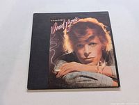 Front cover of David Bowie's Young Americans album showing the artist's portrait and album title.