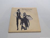 Front cover of Fleetwood Mac Rumours album sleeve with band members artwork.
