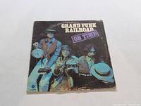 Front cover of Grand Funk Railroad On Time vinyl LP showing the band members and album title.