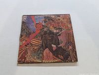 Front of Santana Abraxas album cover with colorful, detailed artwork.
