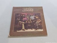 Front cover of Toulouse Street album by The Doobie Brothers showing band photo and album title.