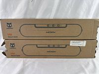 Two MCJOY V69 vacuum sealer boxes stacked showing front side with brand and model details.