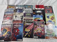 Photo shows assortment of over 20 comic books including Marvel, DC, and indie titles with several Funko Pop! variants in sealed packaging.