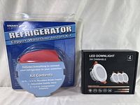 Photo showing the copper refrigerator waterline install kit and the LED downlight 4-pack box side by side.