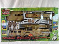 Full boxed set showing camo-painted missile launcher vehicle, soldiers, missile launchers, and accessories in sealed packaging