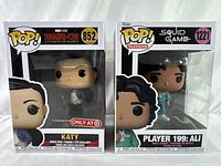 Front view of both Funko Pop figures, Katy and Player 199 Ali, sealed in original packaging.