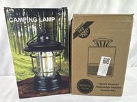 Photo showing the branded camping lamp box and the mosquito killer box side by side.
