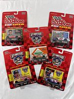 Lot of five vintage Racing Champions NASCAR diecast cars sealed on red 50th Anniversary NASCAR packaging from 1997, showing front card and full lot