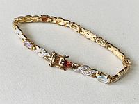Close-up of bracelet end showing clasp and two gemstone links