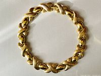 Full view of the chunky vintage gold tone necklace laid flat in a circular shape showing all links.