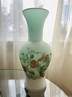 Photo of the full vase showing its shape, color, and decorative motifs.