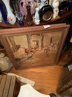 Photo of one framed print showing ballet dancers in studio with the frame and part of the surroundings