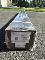 Box end label displaying product code X72R, self lock screen, brand DLA Projectors, with a Made in China sticker