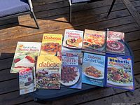 All ten publications laid out on table