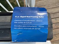Top label on packaging stating 3-1/2 in. clipped head framing nailer in three languages.