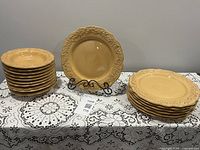 Full set of plates and bowls displayed on table