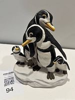 Front view of Franklin Mint 'We Four' penguin family figurine