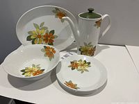 full lot: coffee pot, platter, bowl, four plates