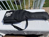 Black Gibson USA soft case front view on table