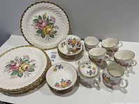 Group shot showing plates, bowls, cups, saucers, sugar bowl