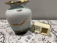 Vase and clock together for scale and contents overview