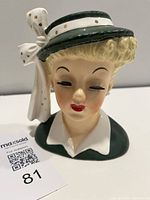 Front view of Napco head vase showing face, hat, bow